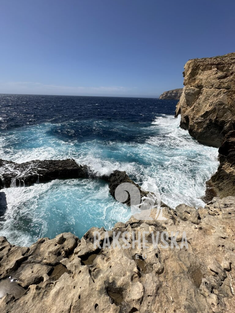 Jagged coastline and turquoise water crashing through natural pools